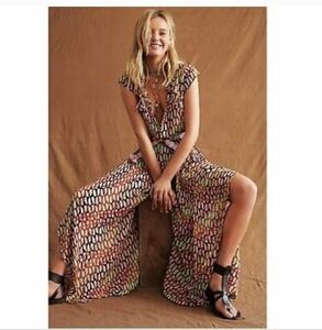 FREE PEOPLE JUMPSUIT W SIDE OPENINGS BEAUTIFUL